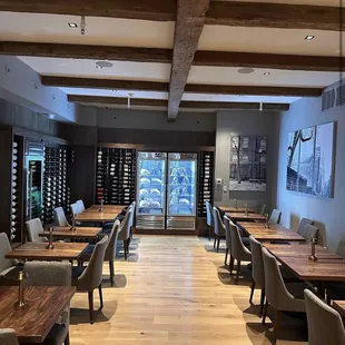 a dining area with tables and chairs