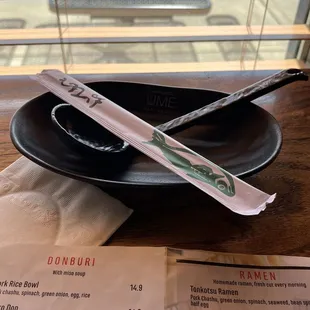 two chopsticks on a plate