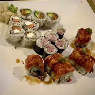 Philadelphia roll, salmon avocado, green dragon roll, yellowtail sushi - dining in the restaurant