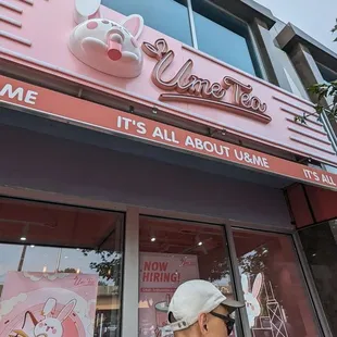 a man walking in front of a store