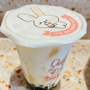 a cup of tea with a bunny on it