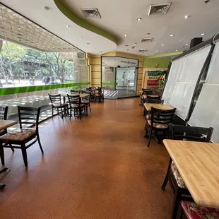 empty tables and chairs in a restaurant