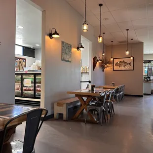 a dining area with tables and chairs