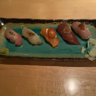 11: Sushi platter: toro ponzu, cod plum sauce, salmon cream cheese and cherry tomato, tuna garlic aioli, sawara garlic ginger