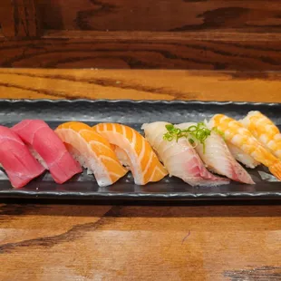 a platter of different types of sushi