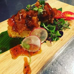 Hanabi (crispy rice topped with spicy tuna, cilantro, and black pepper sauce)