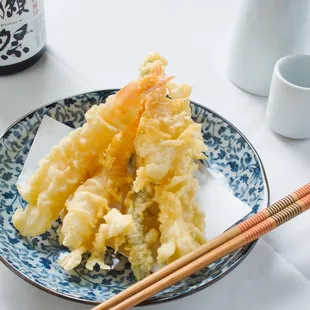 a plate of food and chopsticks