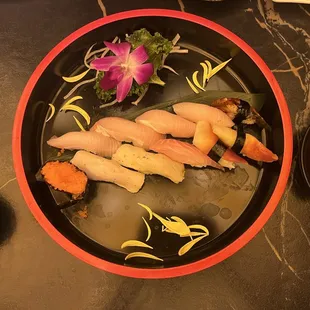 Top: 4 Yellowtail Nigiri, 1 Eel Nigiri Bottom: 1 Roe Nigiri, 2 White Tuna Nigiri, 1 Red Snapper Nigiri, 2 Surf Clam Nigiri