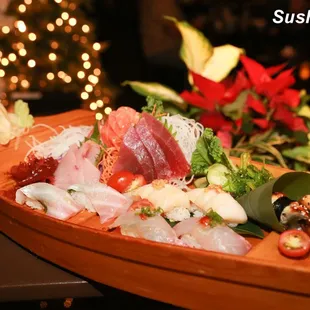 a wooden boat filled with sushi