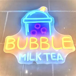 a neon sign for bubble milk tea