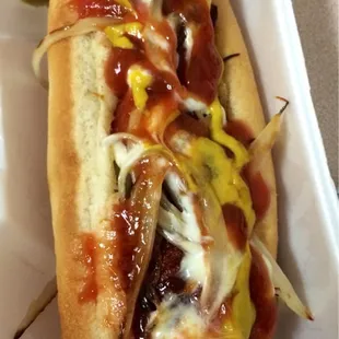 Bacon wrapped hot dog. Looks sloppy, but it&apos;s good.
