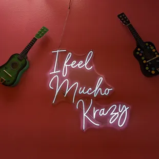  neon sign that says feel much, krazy