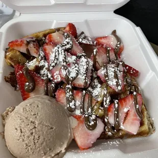 trawberries and ice cream in a styrofoam container