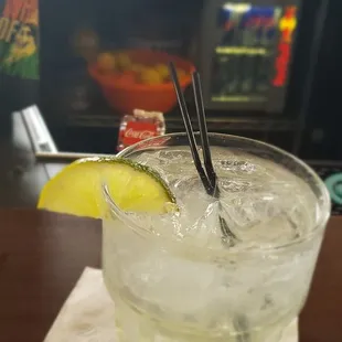 a glass of lemonade with chopsticks