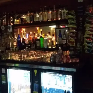 a bar filled with liquor bottles