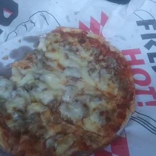 A small beef &amp; pineapple pizza with pepperoncinis on the side!