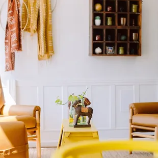 a living room with yellow furniture