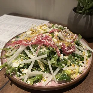 a plate of salad on a table