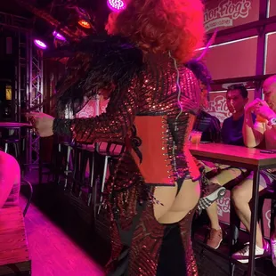 a woman dressed as a drag queen
