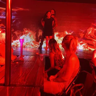 a group of people sitting on a stage
