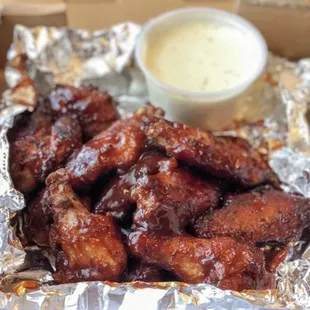 chicken wings in foil with dipping sauce