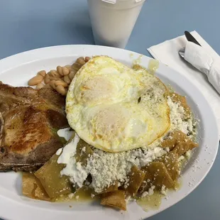 Friday Saturday special. Chilaquiles verdes with two eggs, pinto beans, and pork-chop.  $15.99