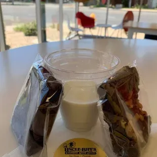 a cup of milk and a sandwich