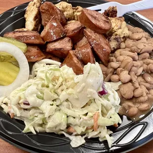 Two meat plate with Georgia Juice Chicken and Smoked Sausage, Coleslaw, and BBQ Beans.