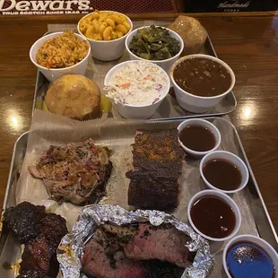 Brisket, pulled pork, rib tips and ribs. collard greens, baked beans, slaw, jalapeño Mac and cheese, jambalaya rice and cornbread muffins.