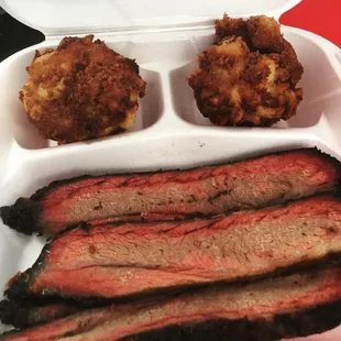 Sliced brisket with deep fried Mac &apos;n&apos; cheese balls