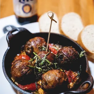 Venison bacon meatballs. So tender and juicy in a tomato stew sauce