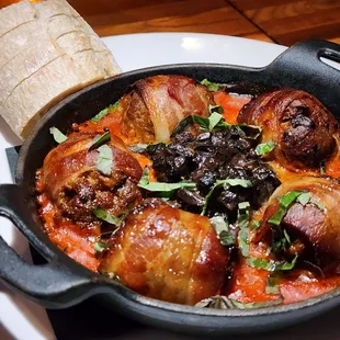 Bacon-wrapped Venison Meatballs in Romesco sauce with fresh mushrooms