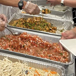 (Left to right) Tuna Mac, Lomi Salmon, Tofu Poke, tossed salad)