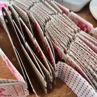 a stack of pizza wrappers