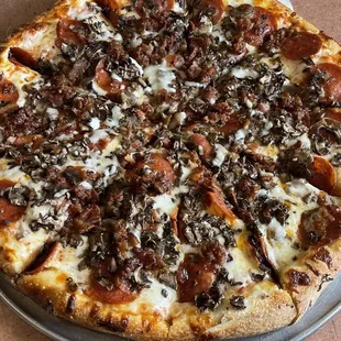 Pepperoni, Bacon, Mushroom Pizza