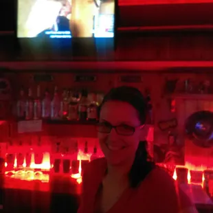 a woman with glasses and a red light