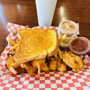 a grilled cheese sandwich and fries