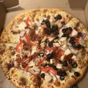 Chicken, bacon ranch pizza + olives on one side.  toppings like the chicken could&apos;ve been spread out more but altogether it was tasty.