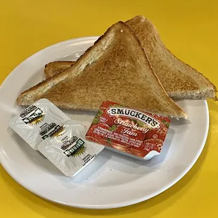 a sandwich and butter on a plate