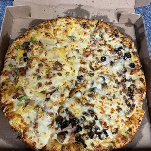 Extra cheese supreme added half pineapple and half black olives