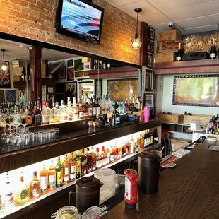 a bar with a television on the wall