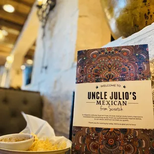 a bowl of mexican food and a menu