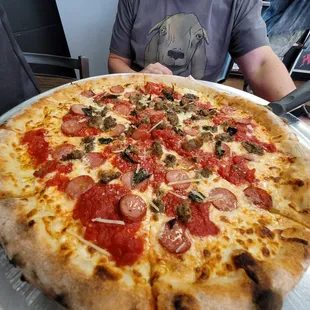 This pizza was deeeeeelish! The chopped meatballs, Basil and red sauce in every bite topping the perfect chewy bubbly crust.