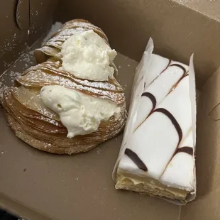 Lobster tail (sfogliatelle) filled with Canoli cream and a napoleon slice on the right. Both delicious.