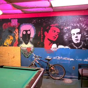 a pool table and a bicycle