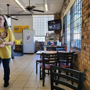 a woman standing in a restaurant