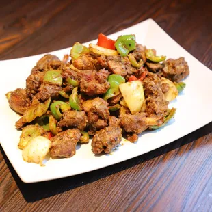 a plate of food with meat and vegetables