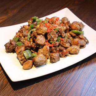 a plate of stir fried meat