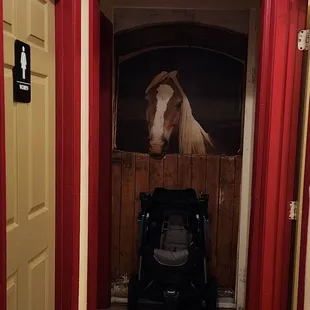 Going to the restroom? Hello, beautiful horse!