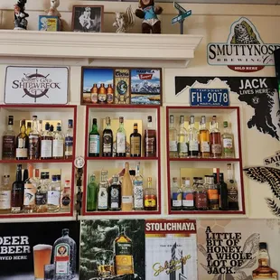 Display wall with vintage toys and stuff on top